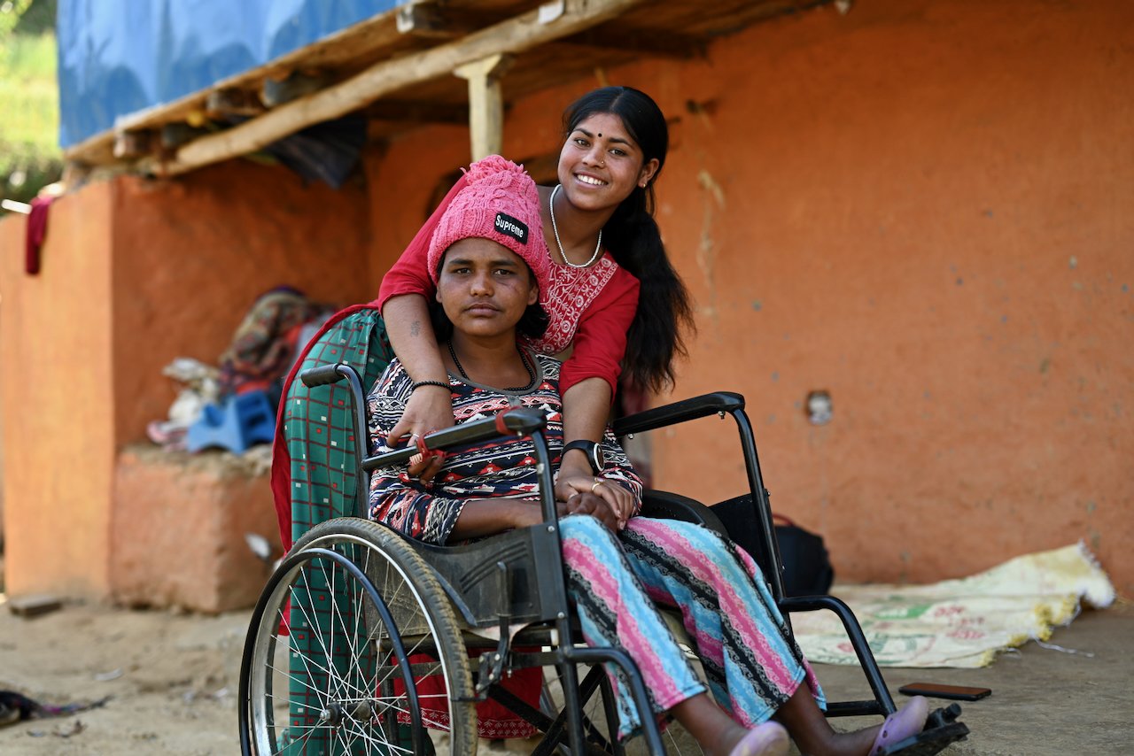 A young girl in a wheelchair