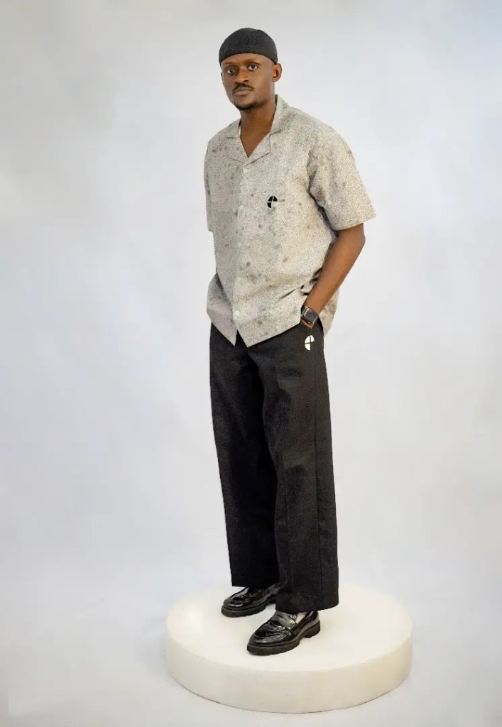 A model rocking a piece from the Surprano more collection whule standing on a stool