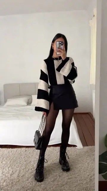 A lady rocking sweater and miniskirt autumn outfit