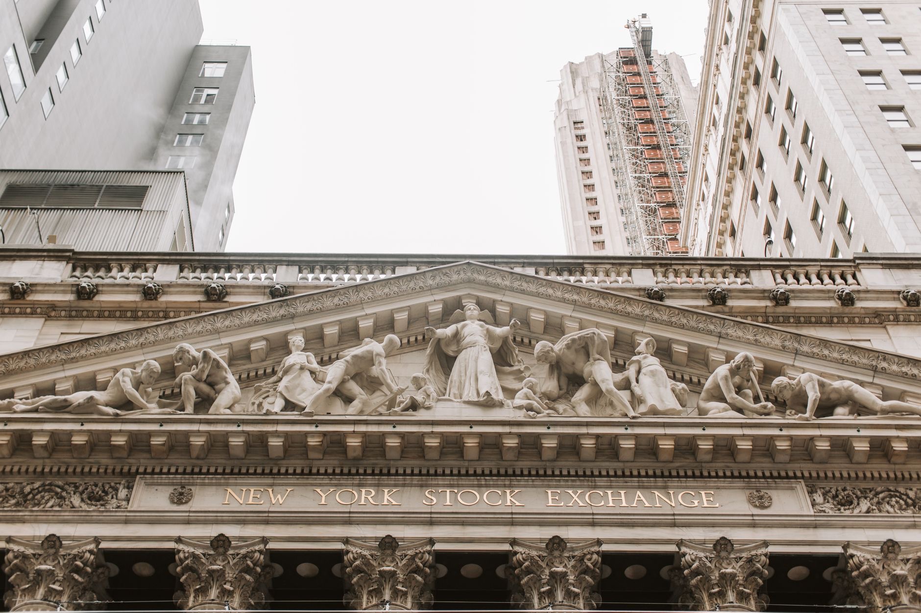 Traders monitor market screens on the New York Stock Exchange floor as major U.S. stock indexes advance.