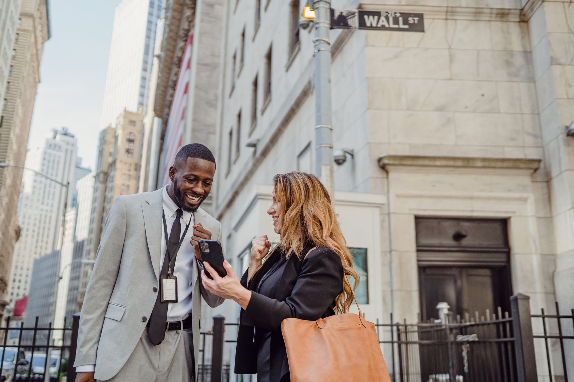 Traders monitor stock prices on the New York Stock Exchange floor as markets react to weaker U.S. employment data.
