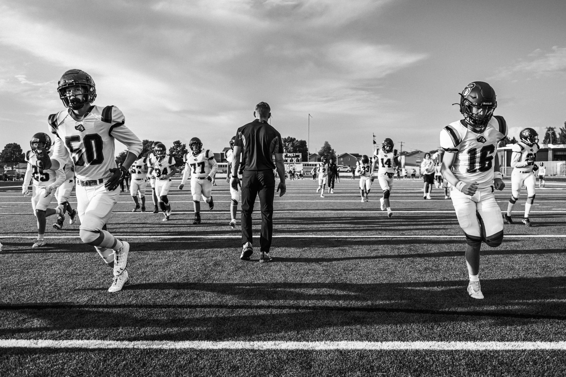 NFL and college football players compete as changing eligibility rules fuel debate over movement between the professional and college games.