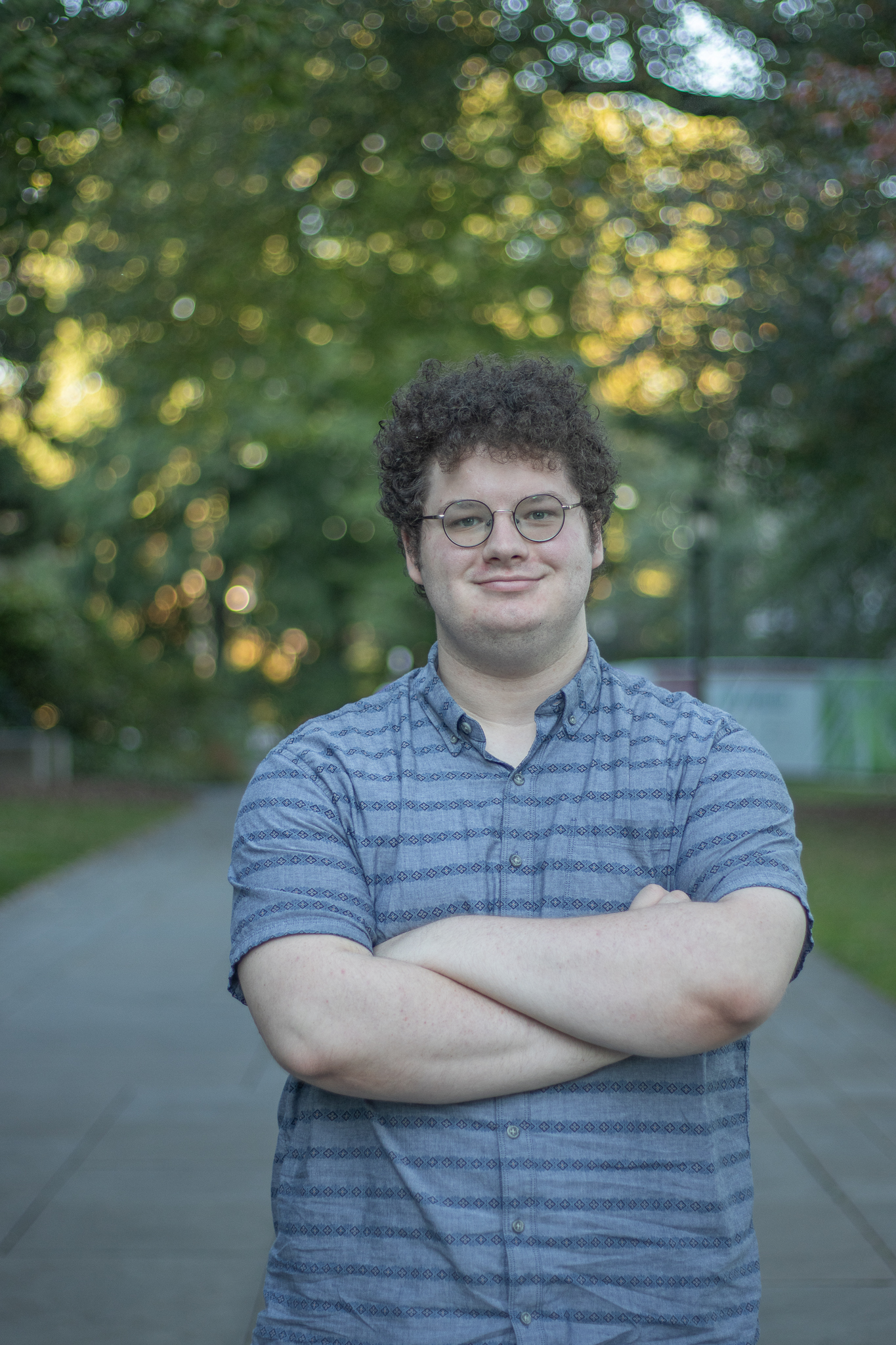 Author Wyatt Brannon stands on McGill Walk smiling