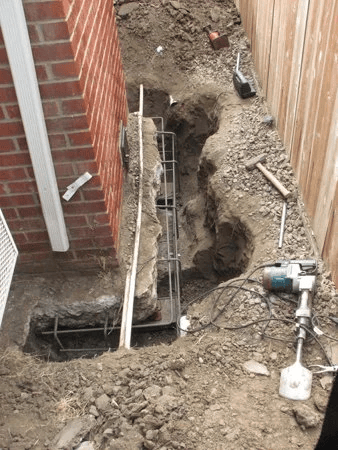  Rebar set and ready — rebuilding the chimney's footing so it has something solid to stand on again. 