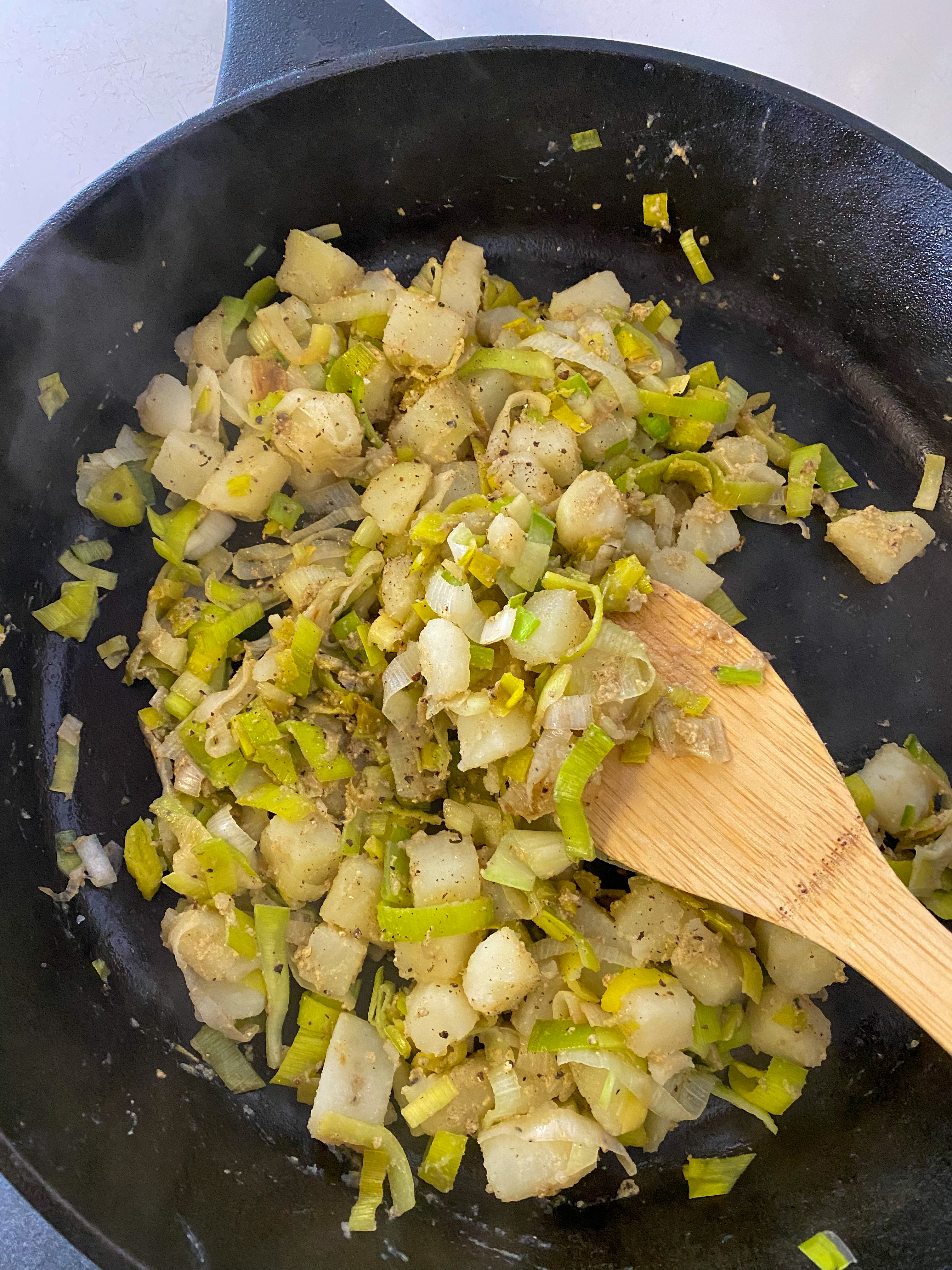 Cast iron skillet with cooked and mixed filling