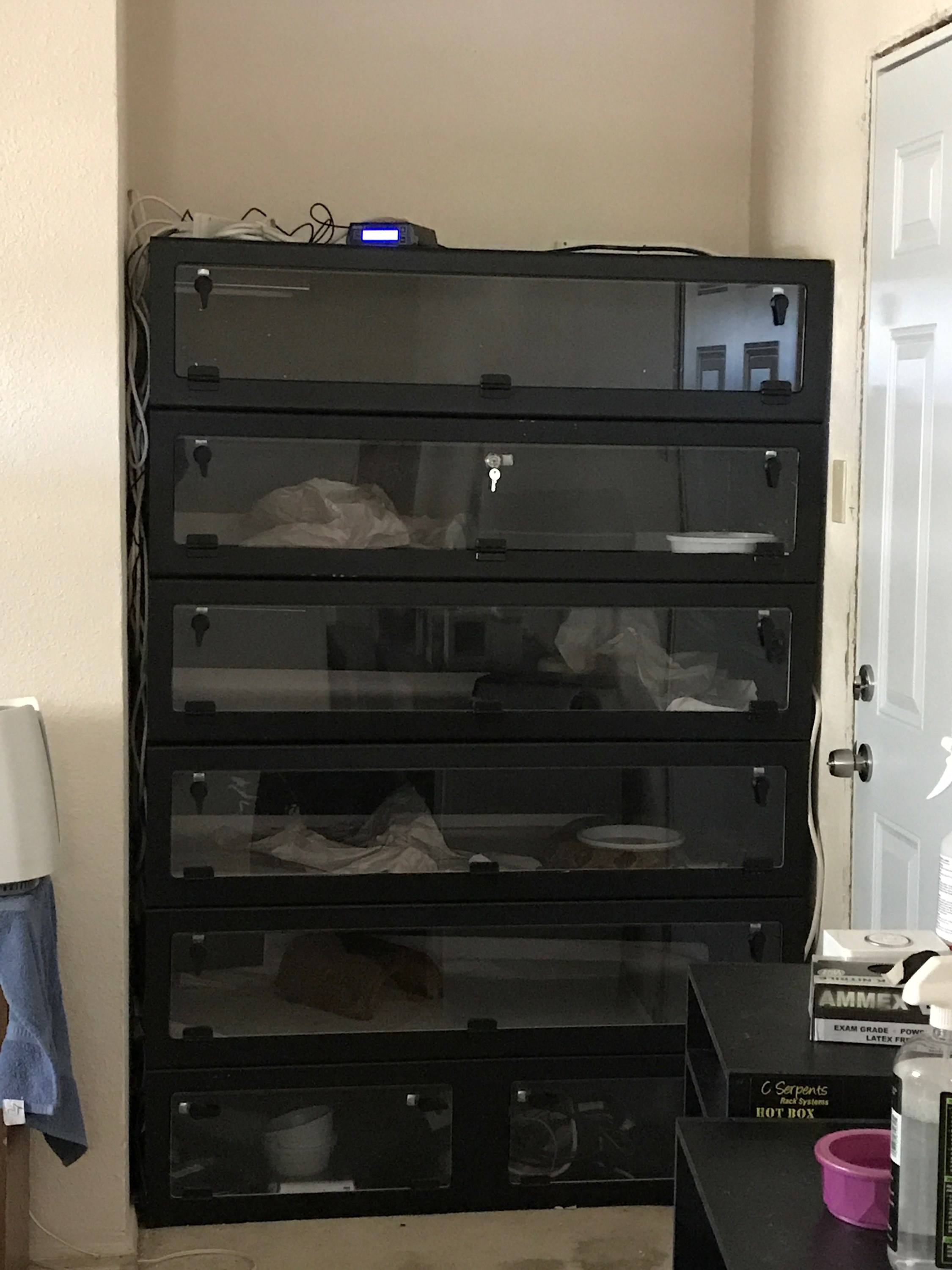 A stack of 5 black Boaphile cages.