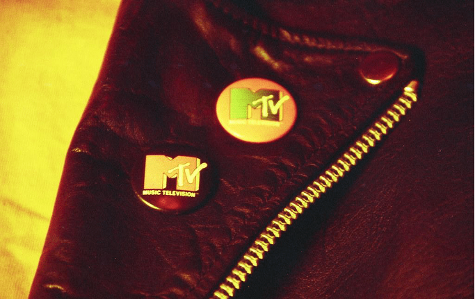 MTV badges on the lapel of a leather jacket