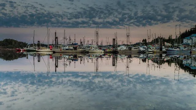 ocean, ocean reflection and boats at sunset