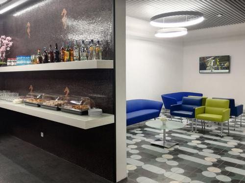 Cross section image of CIP lounge Faro airport with drinks area and seating area