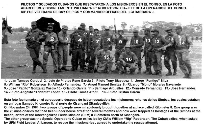Congo rescue operators; Rip Robertson standing in back, 4th from left, with several Cuban exiles. The significance of the date - November 22, 1964 - and the open, black umbrella are curious.