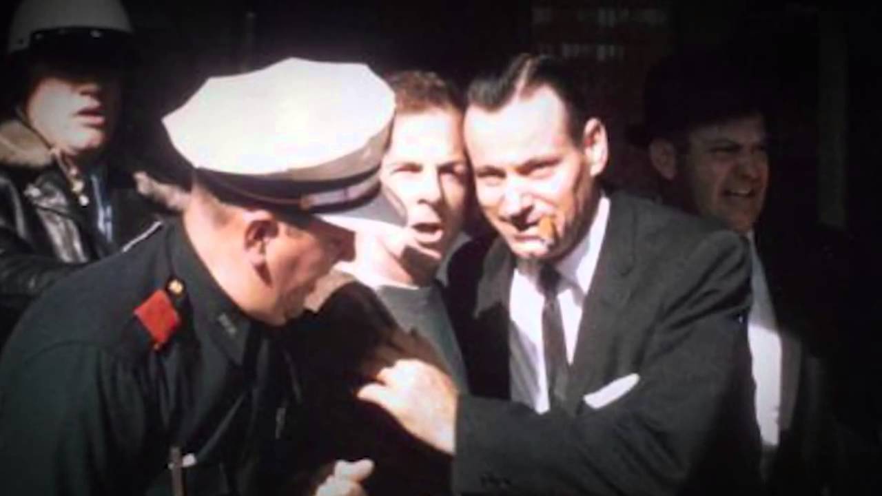 Oswald arrested by Patrolman C.T. Walker and Detective Paul Bentley