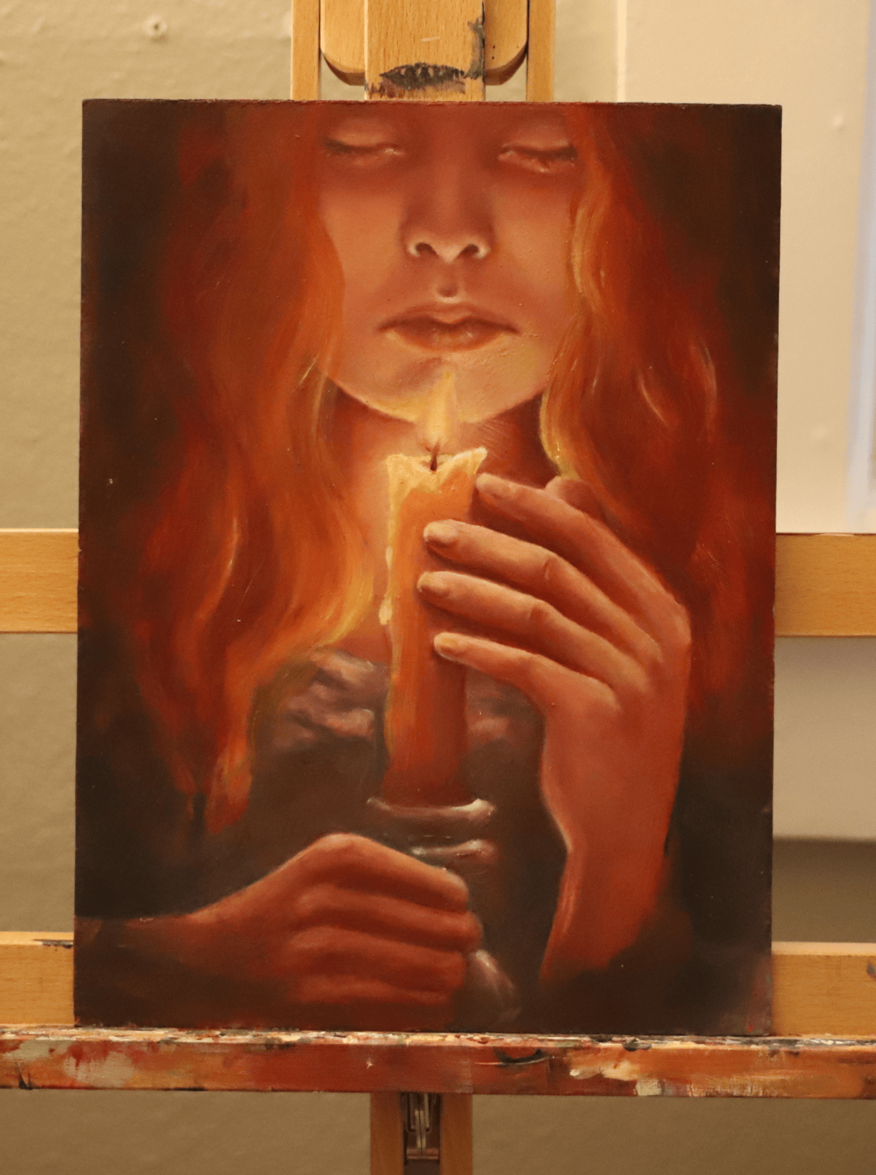 Woman holding candle painting