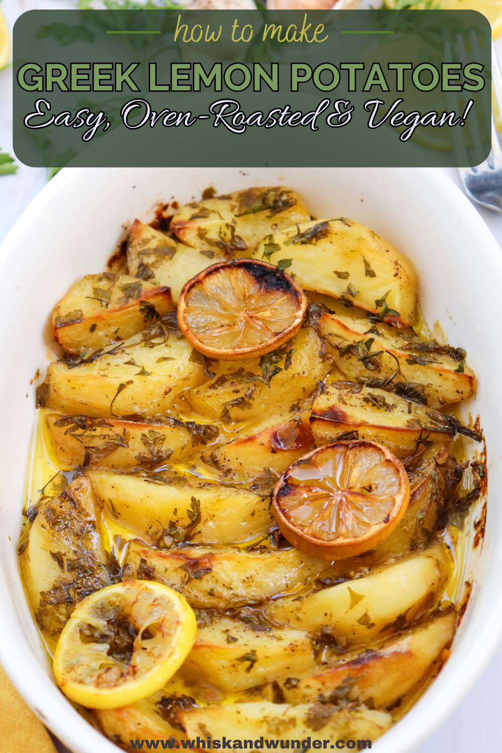 A pan of Greek lemon potatoes, golden and crispy, garnished with lemon slices and herbs.