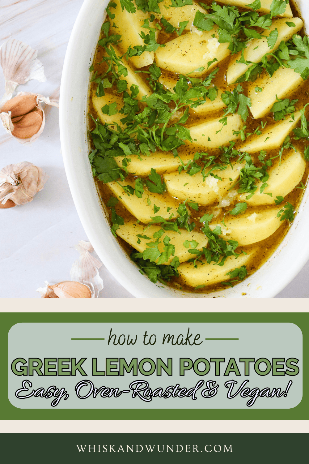 A baking dish filled with Greek lemon potatoes seasoned with herbs and olive oil, garnished with fresh parsley and garlic cloves in the background.