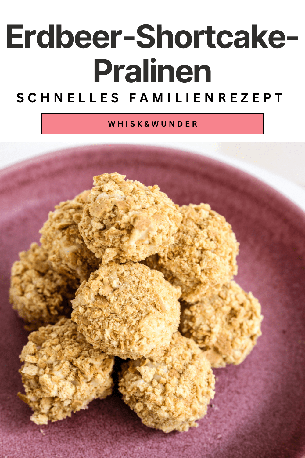 A close-up view of several strawberry shortcake pralines stacked on a purple plate, with the title 'Erdbeer-Shortcake-Pralinen' and the subtitle 'Schnelles Familienrezept' displayed above.