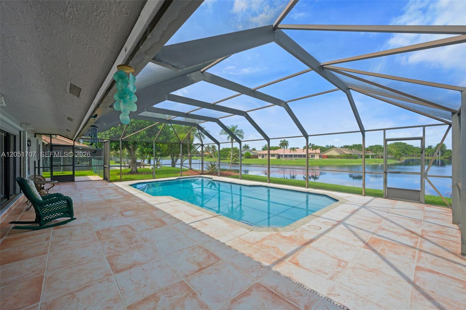 An ample patio with an oversized pool to is perfect for entertaining.