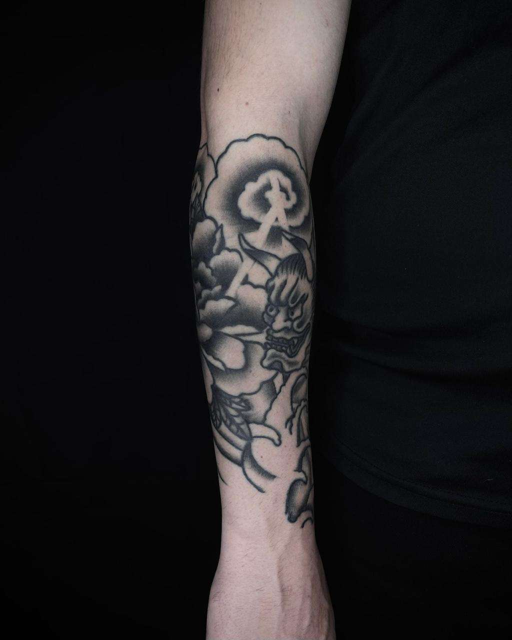 black & grey blackwork tattoo of skull on the full sleeve