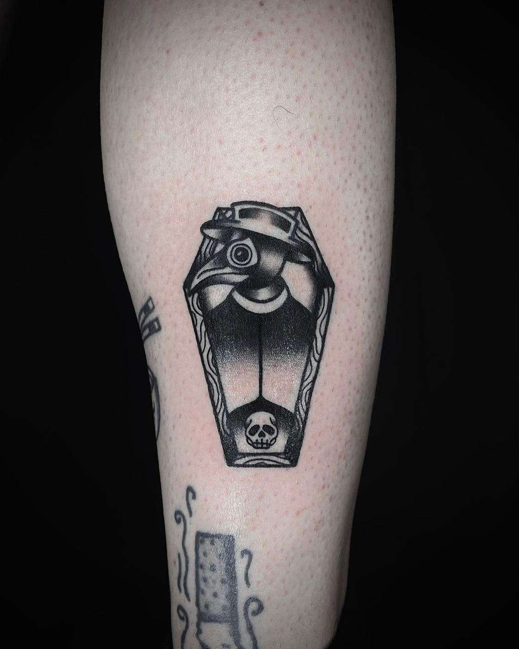 black & grey blackwork tattoo on the forearm