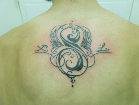 Tatuaje De Las Letras X S L Con Dos Alas