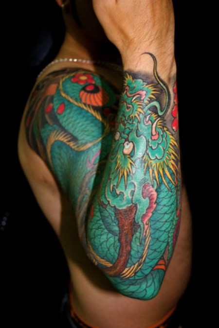 Tatuaje De Un Dragon En El Antebrazo