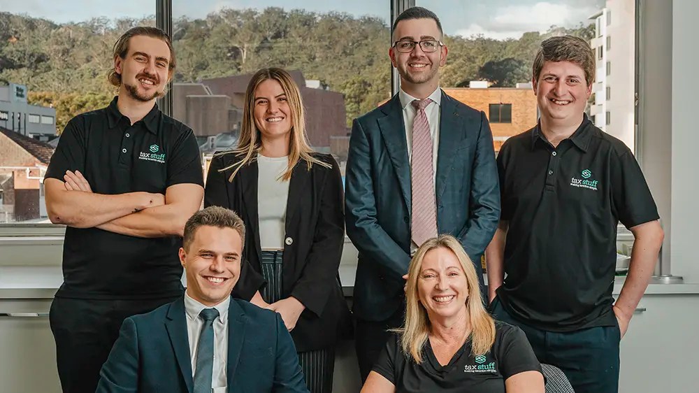 The Tax Stuff accounting team stands together smiling in the Central Coast office.