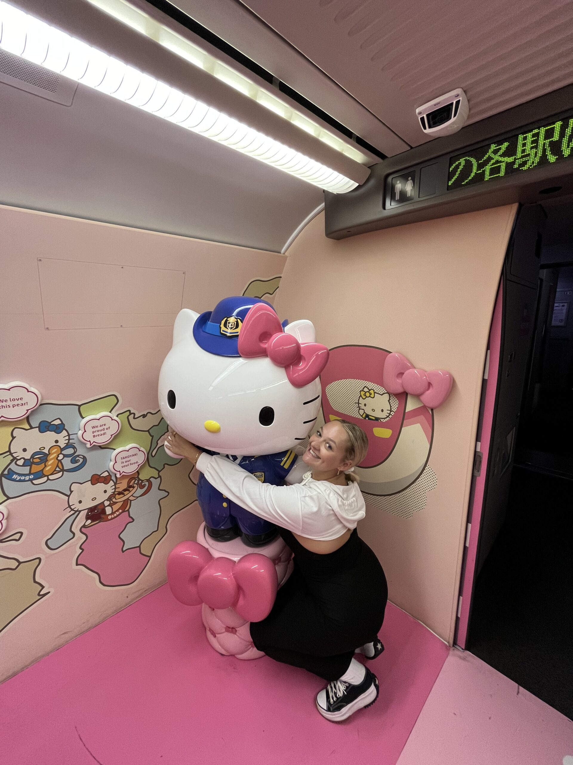 posting with the Hello Kitty statue on the Hello Kitty bullet train