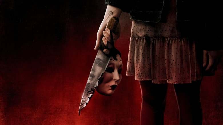 Maya flees through a forest as masked killers hunt her in The Strangers: Chapter 2