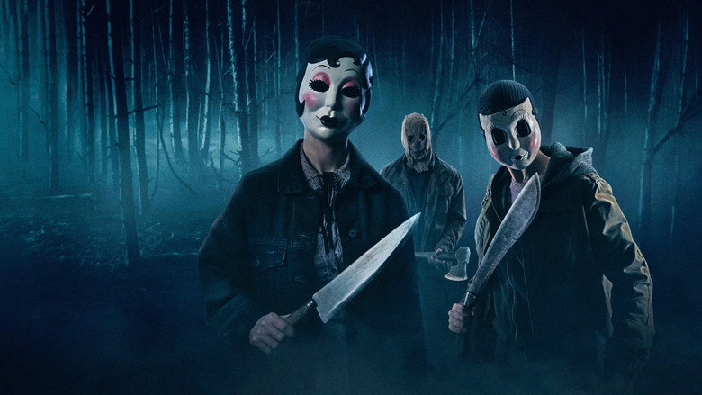 Masked stranger looming in a dark cabin hallway in The Strangers: Chapter 1