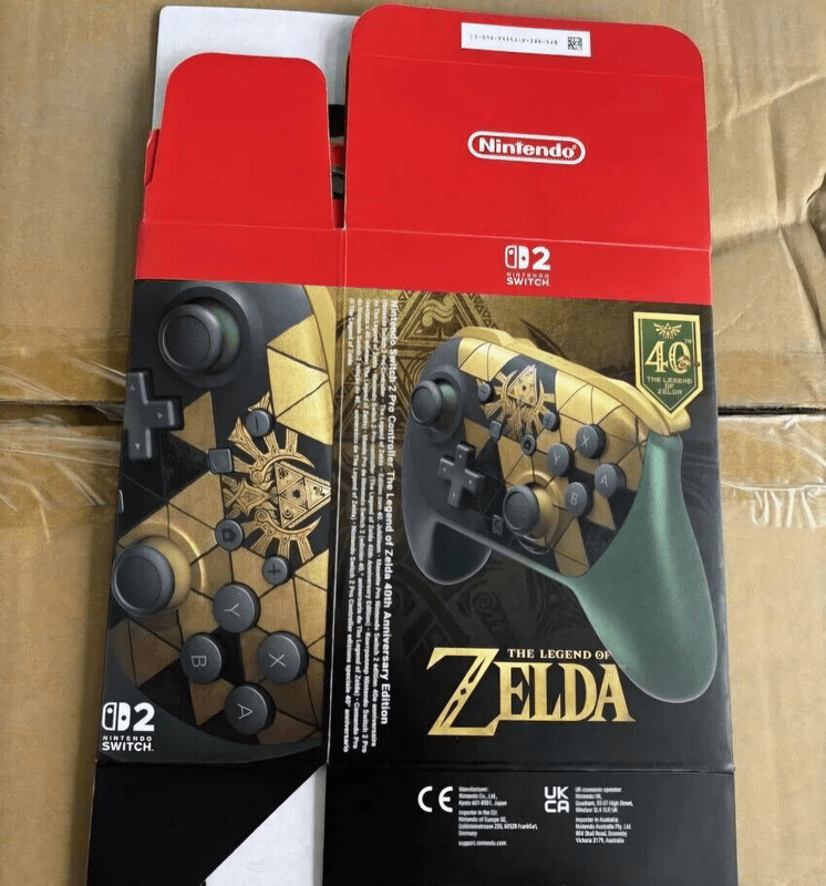 Zelda 40th anniversary Switch 2 Pro Controller packaging with gold Triforce faceplate and green grips