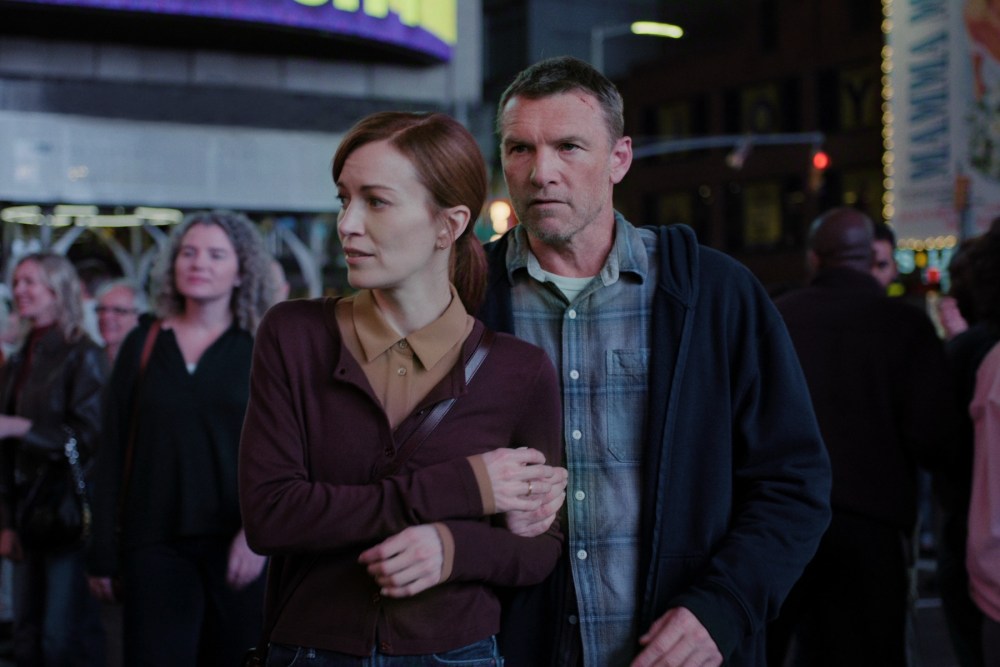 Sam Worthington and Britt Lower walk through Times Square in Netflix's I Will Find You