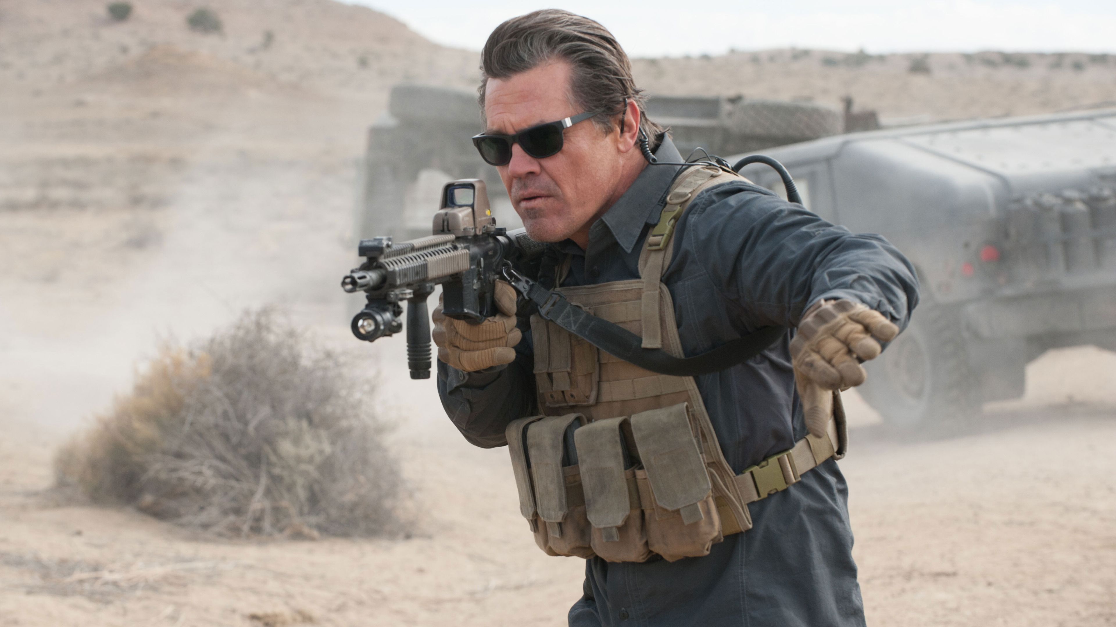 Josh Brolin as CIA officer Matt Graver aiming a rifle in Sicario: Day of the Soldado
