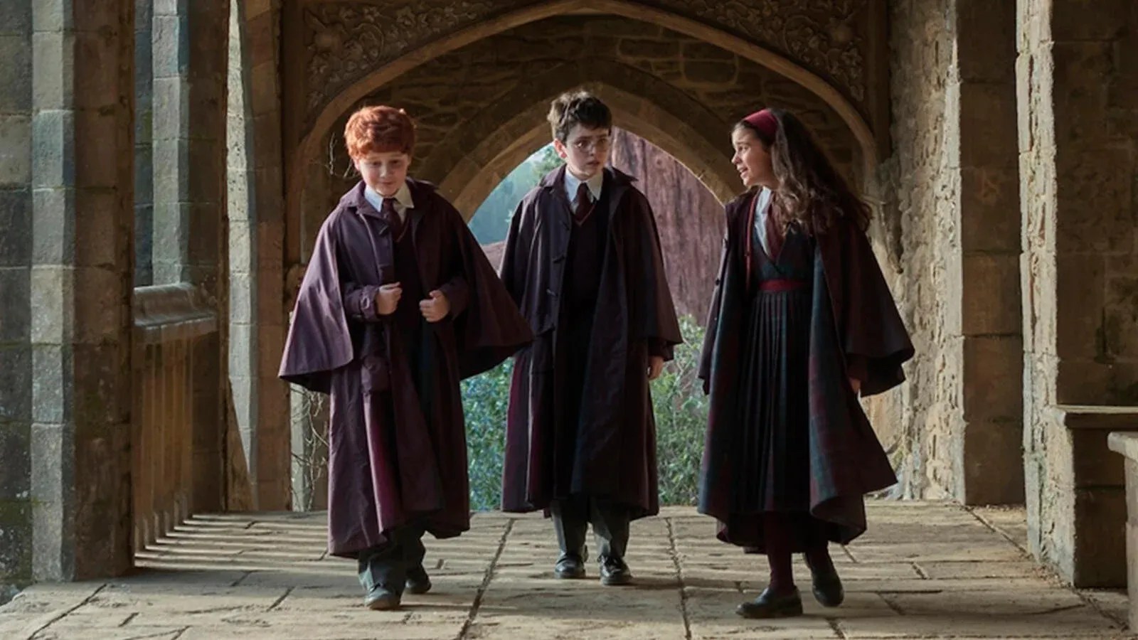 The new Harry, Ron and Hermione walk through a Hogwarts corridor in HBO's Harry Potter series