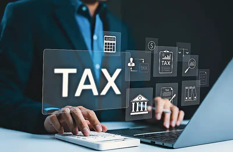 Concept image of tax paperwork and a calculator for the UAE e-cigarette tax decision
