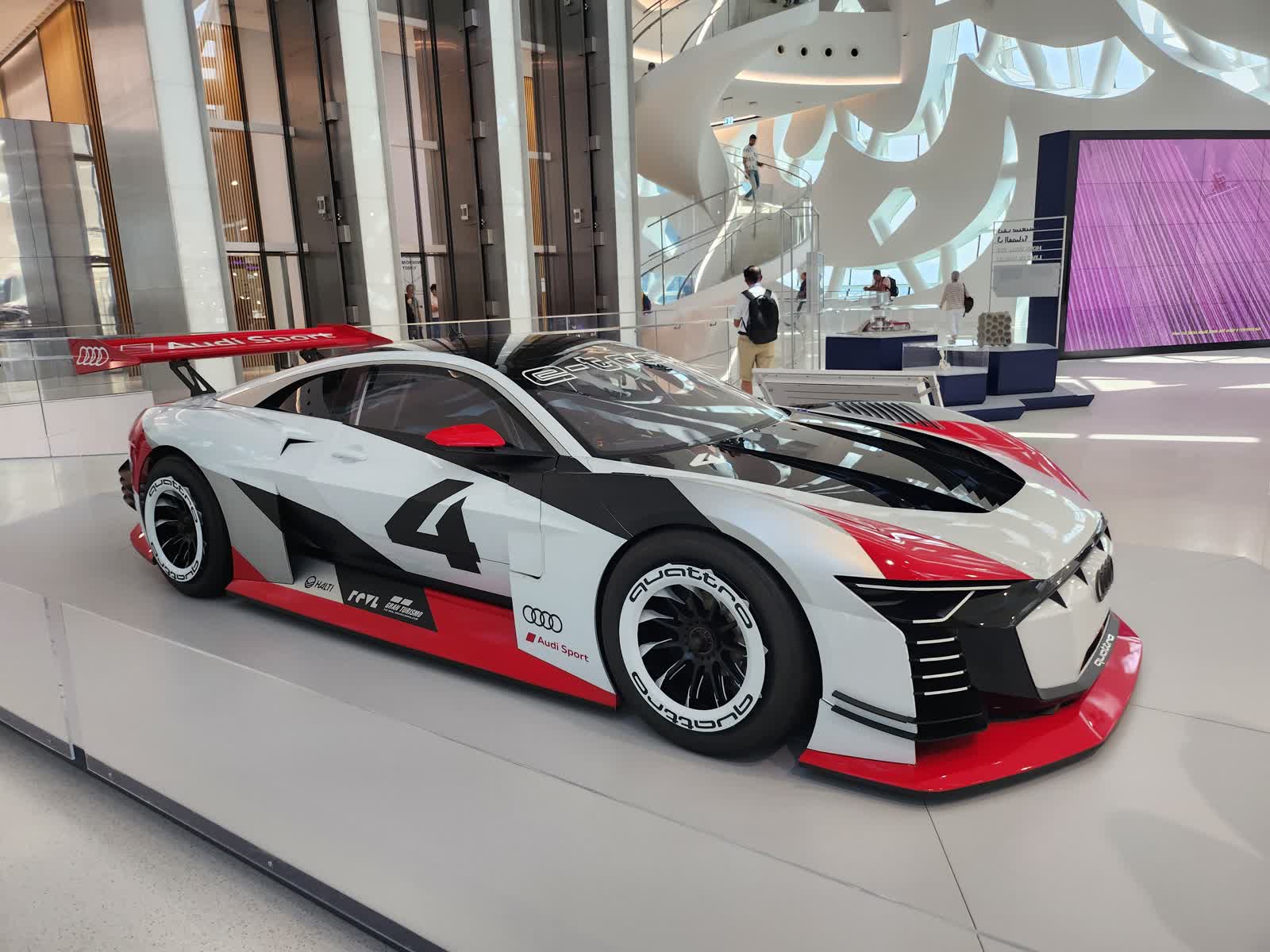 Inside the Museum of the Future Dubai with white curved architecture and an Audi display