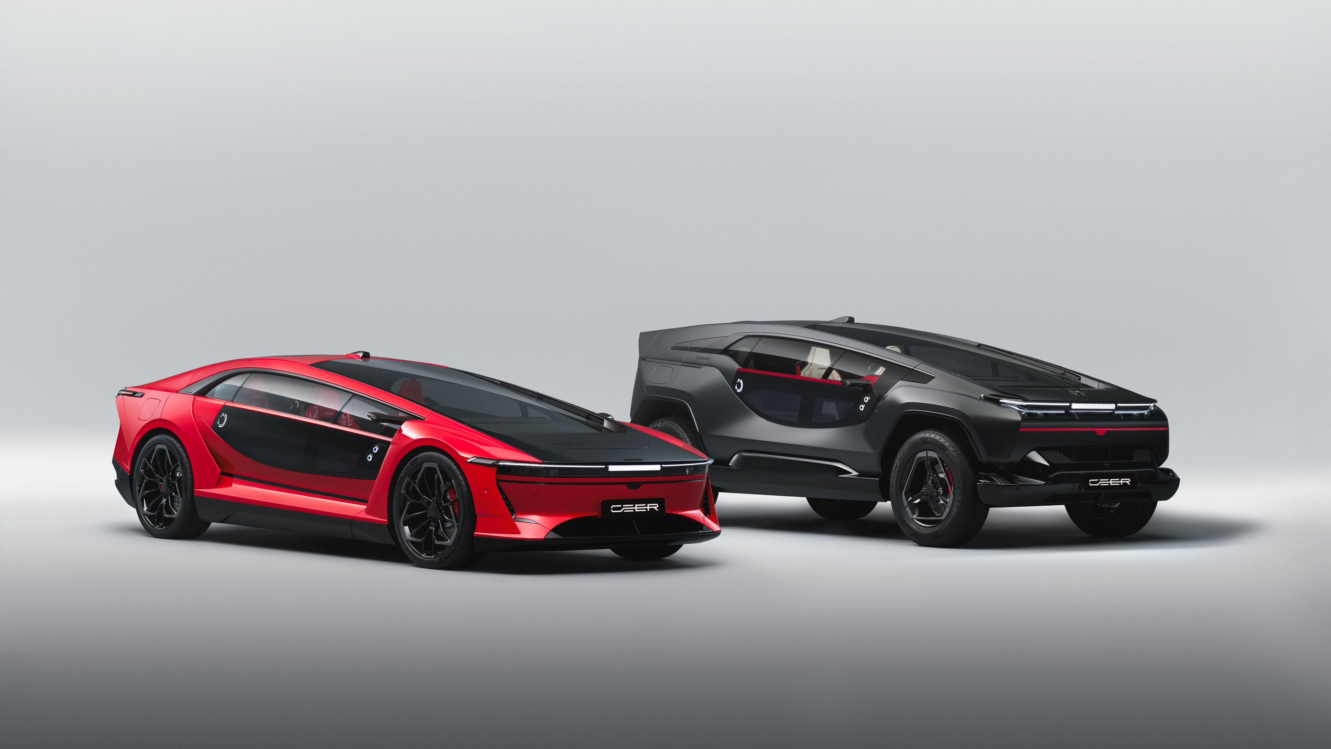CEER EXOBOT electric sedan and SUV shown together at launch