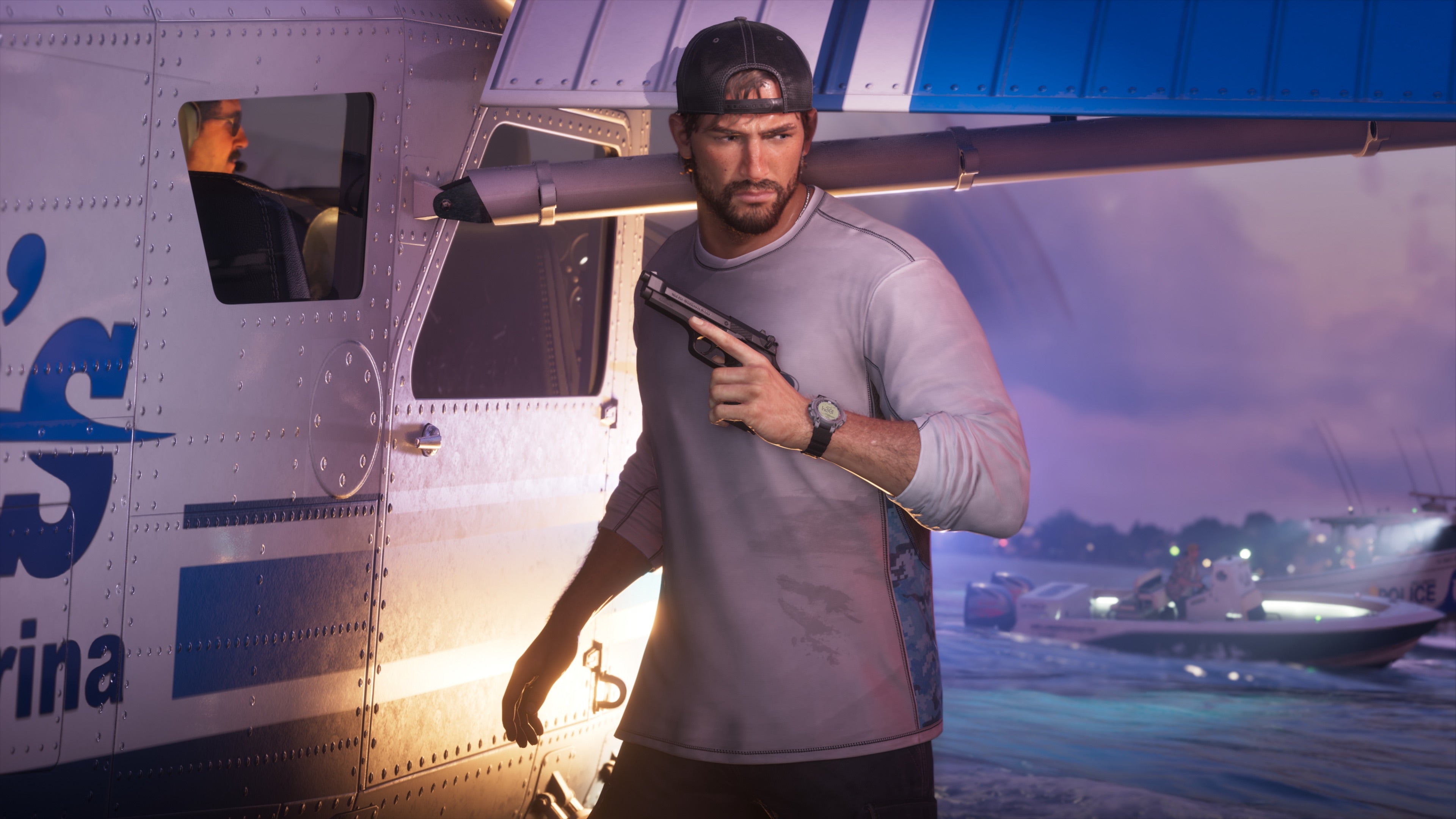 GTA 6 protagonist Jason holds a pistol beside a seaplane