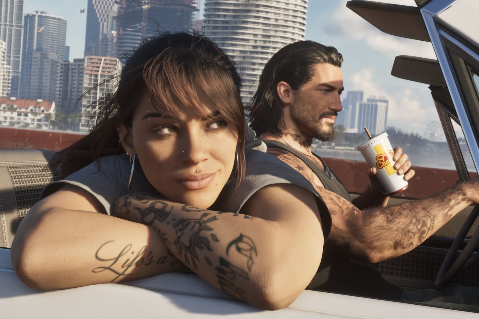 GTA 6 protagonists Lucia and Jason in a convertible in Vice City
