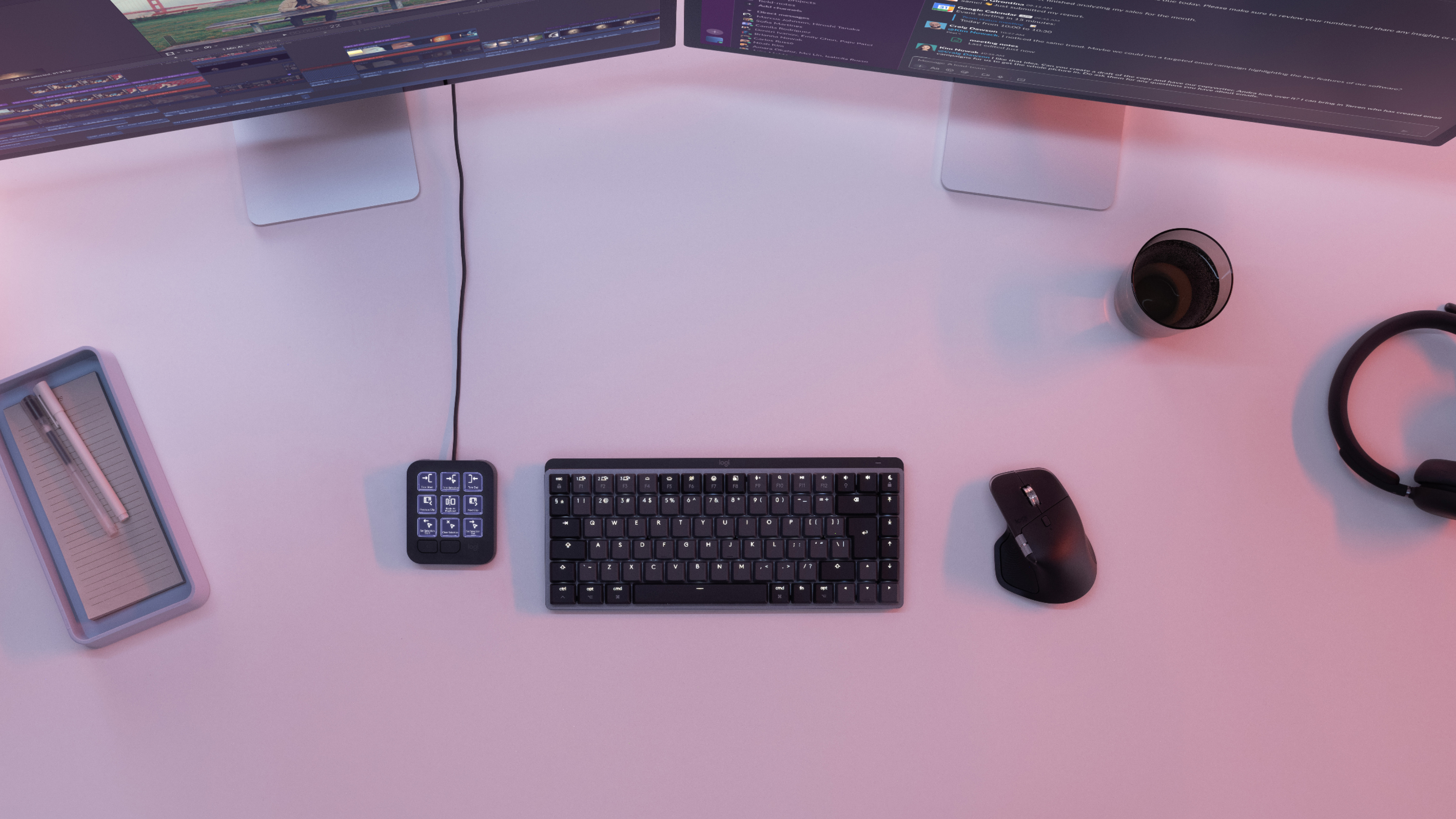 Logitech MX Keypad with illuminated shortcut buttons beside a keyboard