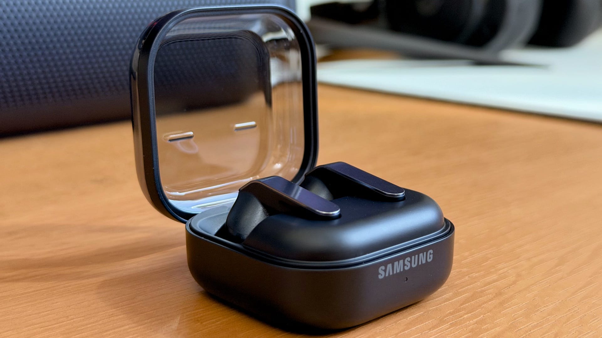 Samsung Galaxy Buds earbuds inside an open charging case