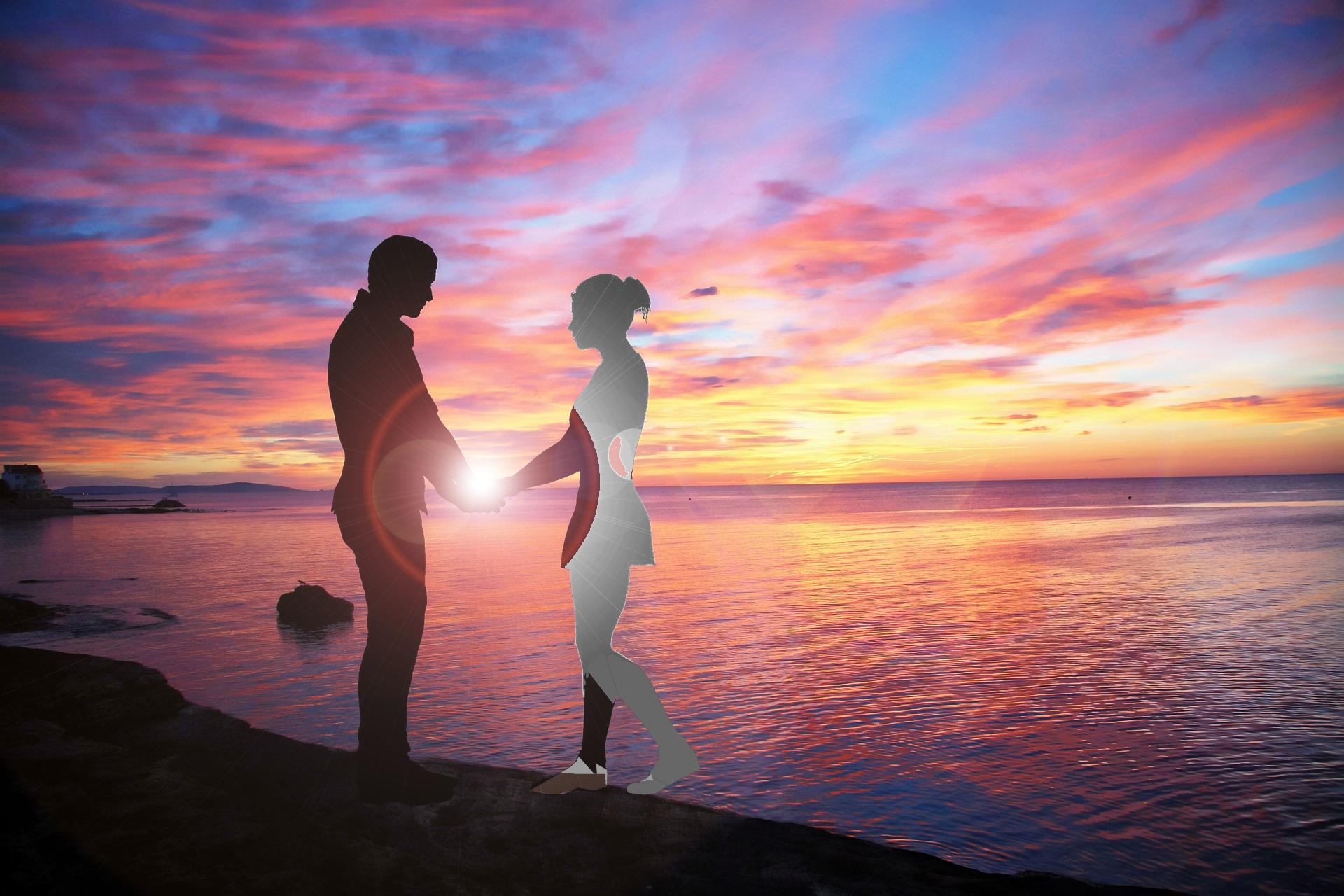 man holding a spectral lady by beach
