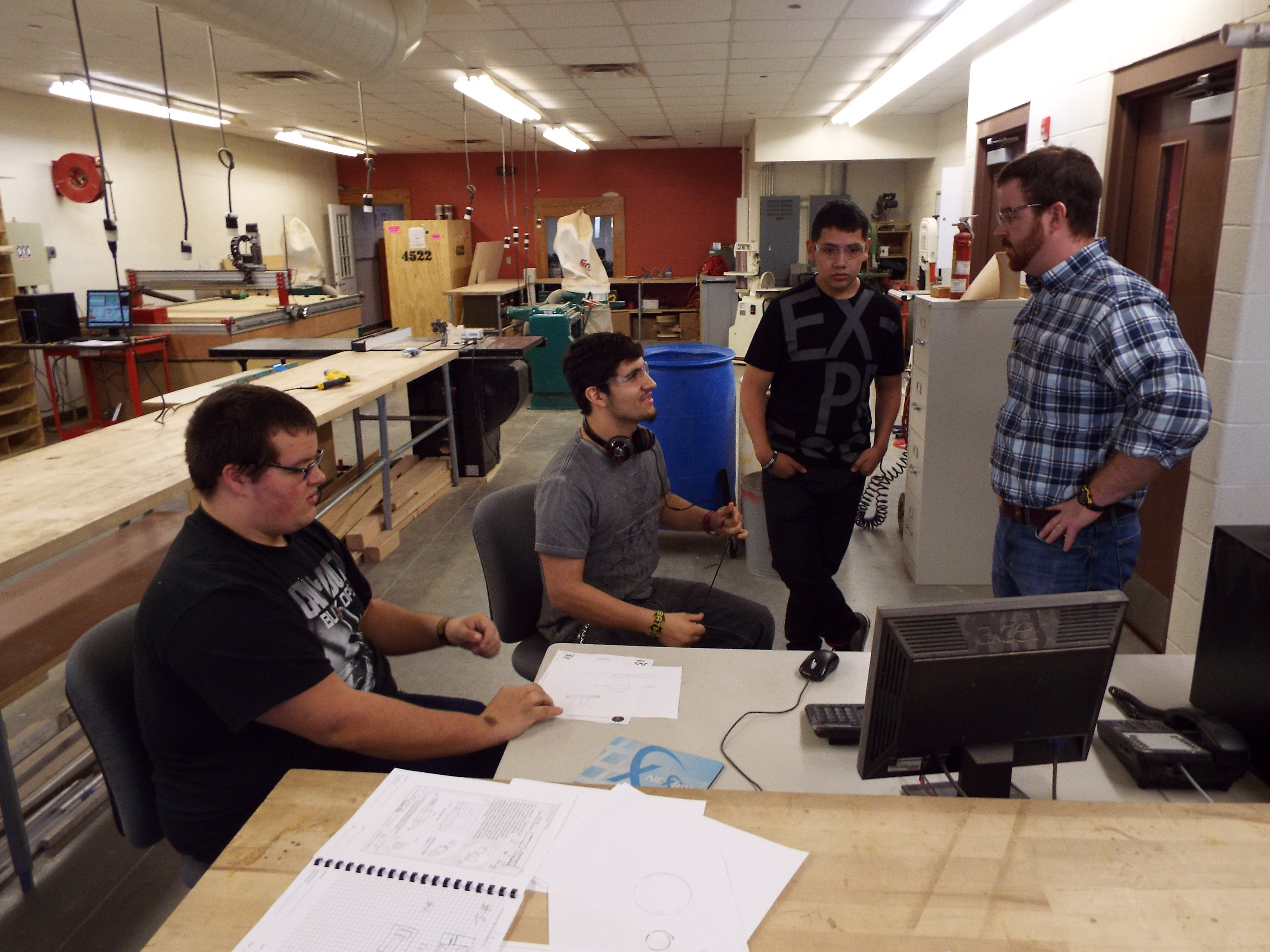 The special projects team discusses ideas with Mr. Wright.