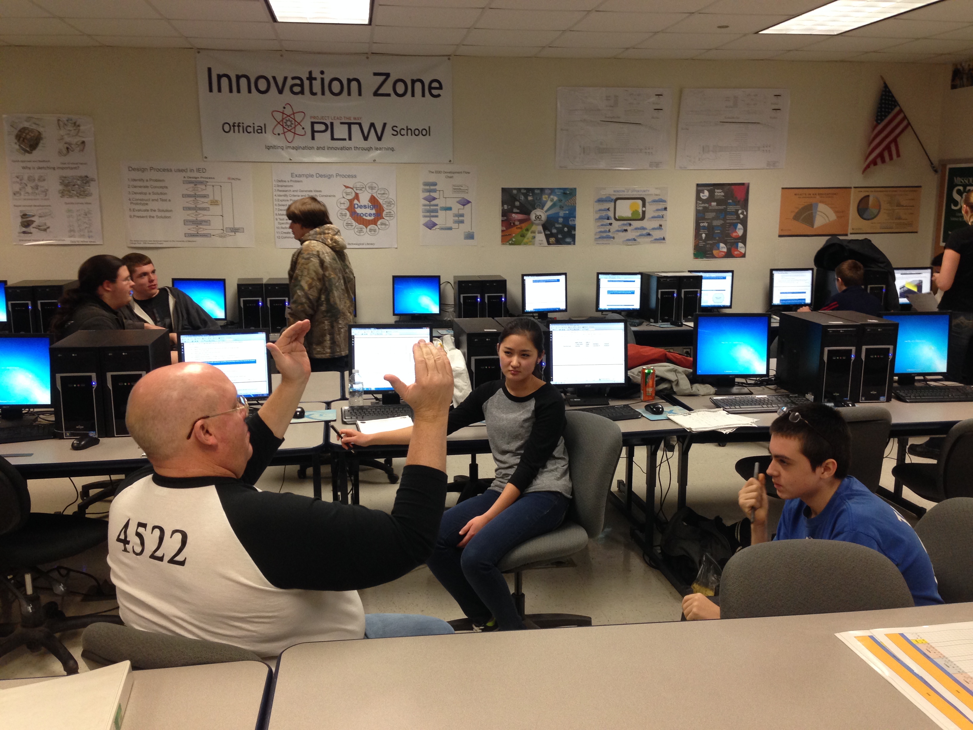 A group of Team SCREAM members strategize scenarios