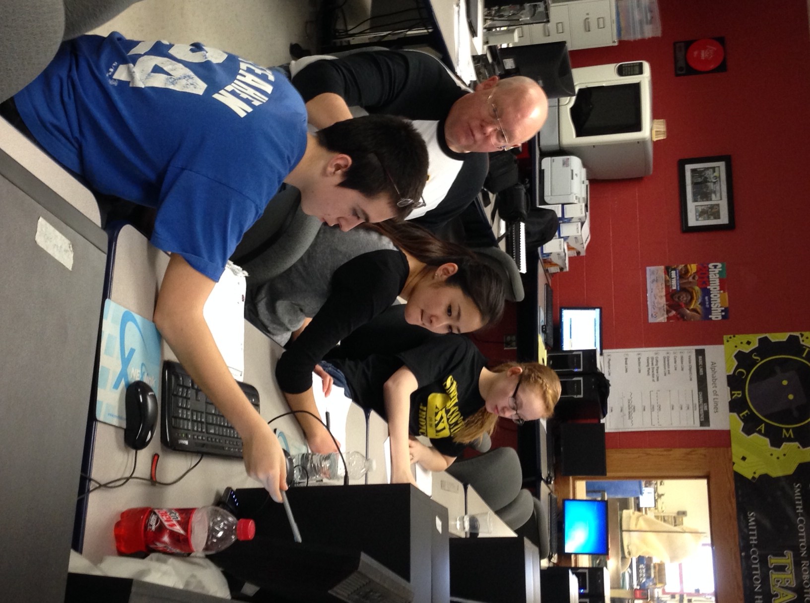 Bill Chapman, mentor, discusses team strategies with his group