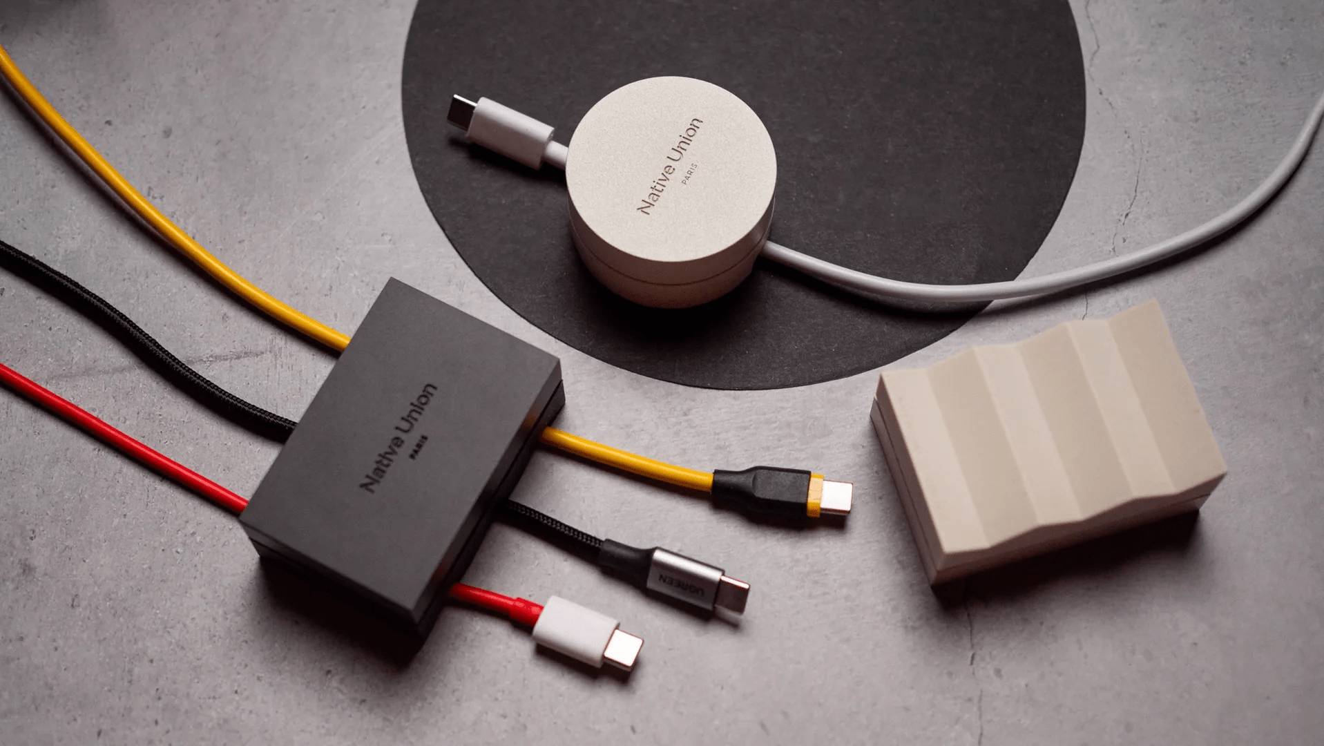 I used a $30 cable weight, and it is now my favorite desk accessory