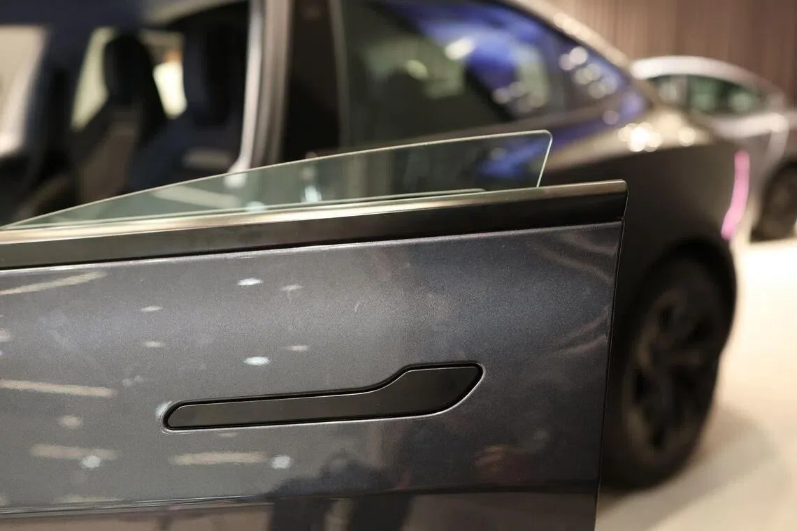China flexes its auto-safety chops with huge recall of Tesla, other cars