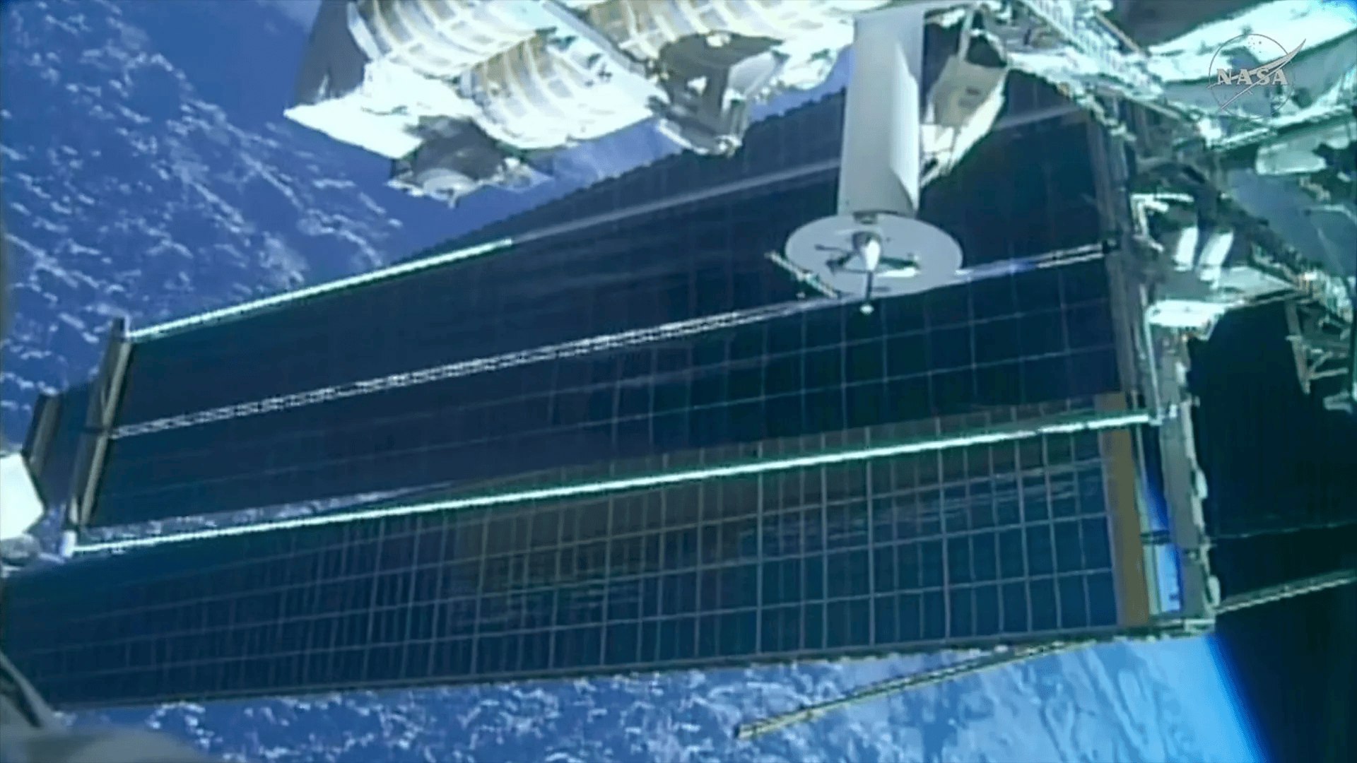 Astronauts deploy solar array on 100th US spacewalk by International Space Station crew members