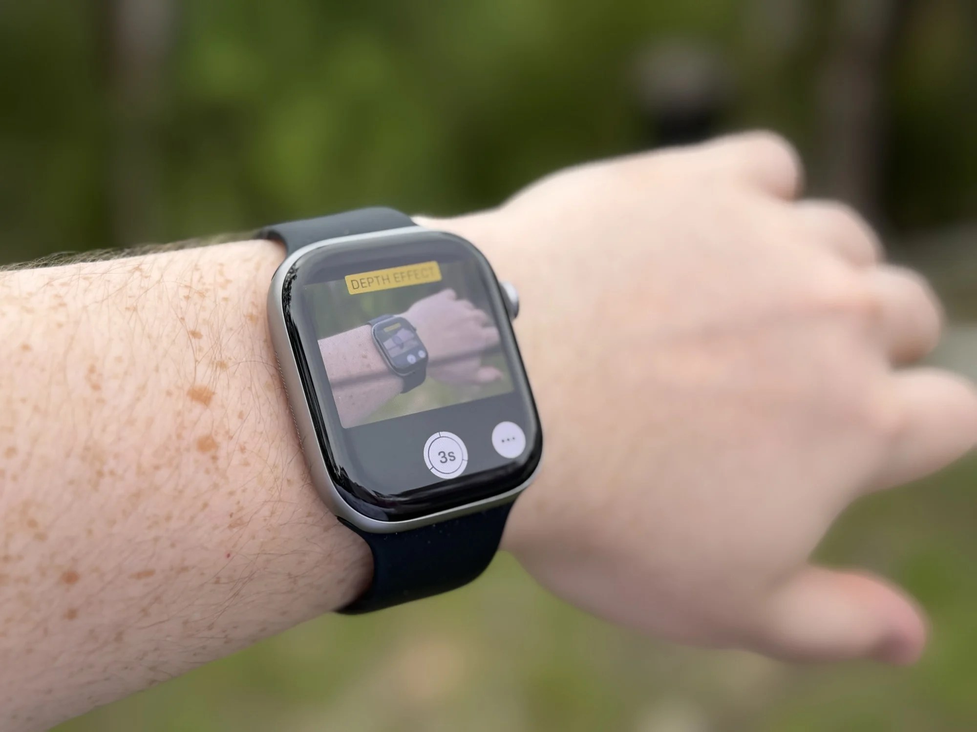 Apple Watch Series 11 being used with an iPhone to take photos
