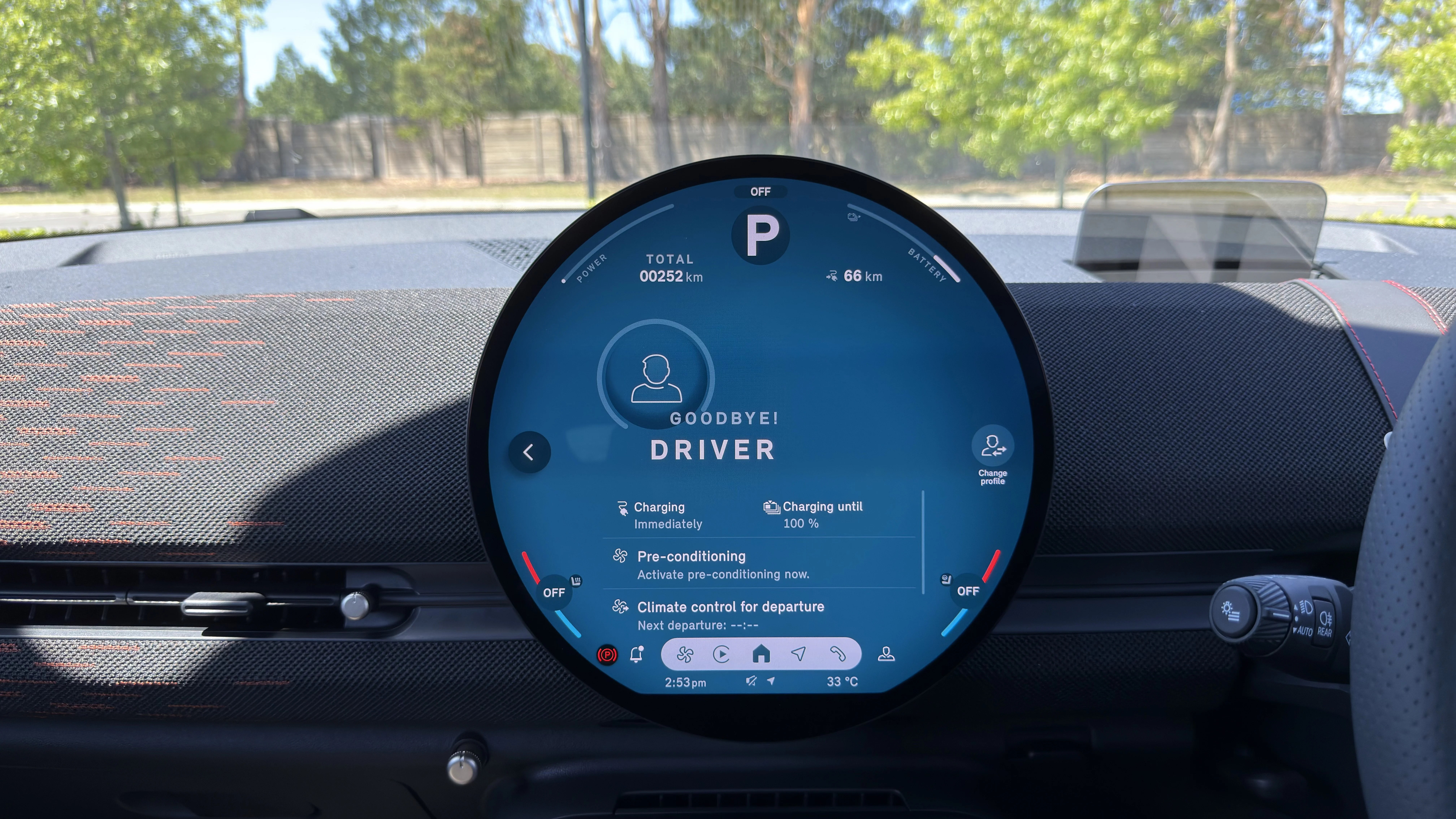 2026 Mini Aceman JCW interior circular central display reading 'GOODBYE! DRIVER', charging status and 66 km range