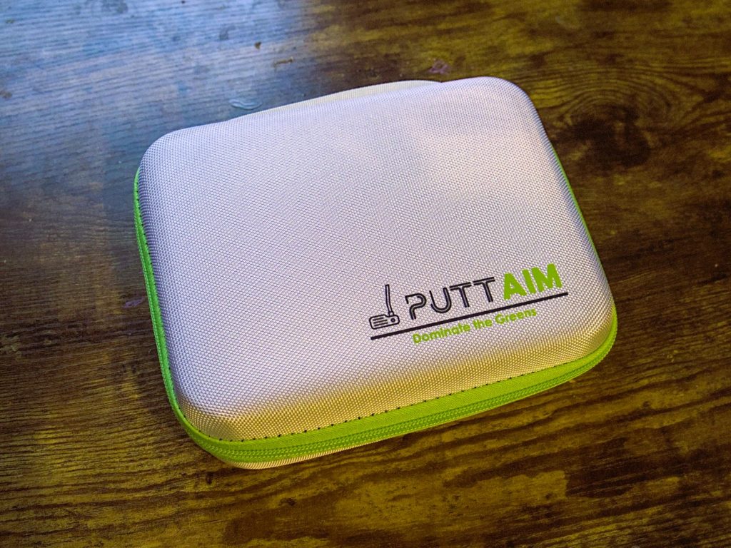 PuttAIM+ carrying case zipped up on table -- Techigar