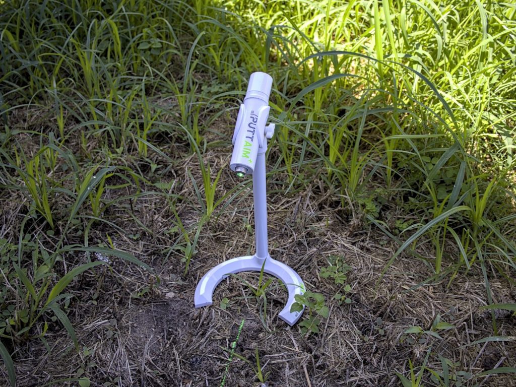 PuttAIM+ in patch of dead grass with laser on -- Techigar
